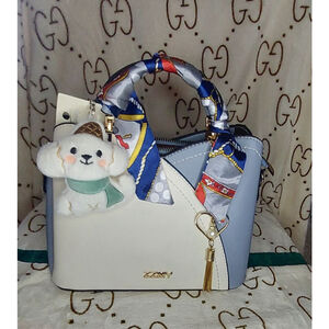 Beatiful Blue & White bag with twilly, pearl charm, and cute plush puppy charm
